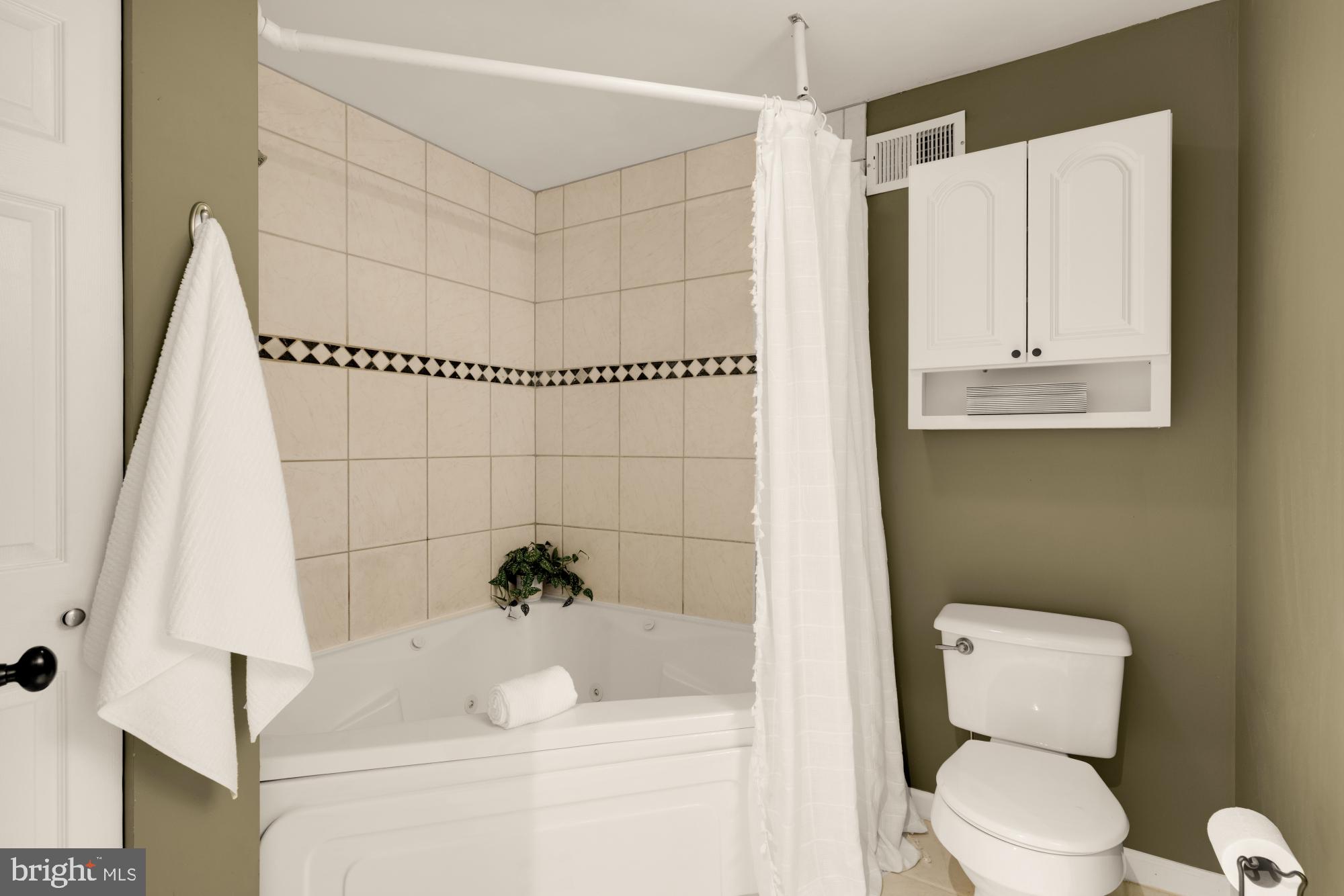 545 Gittings Street Baltimore, MD 21230 - Photo 15 of 40 a white toilet sitting next to a bathroom sink