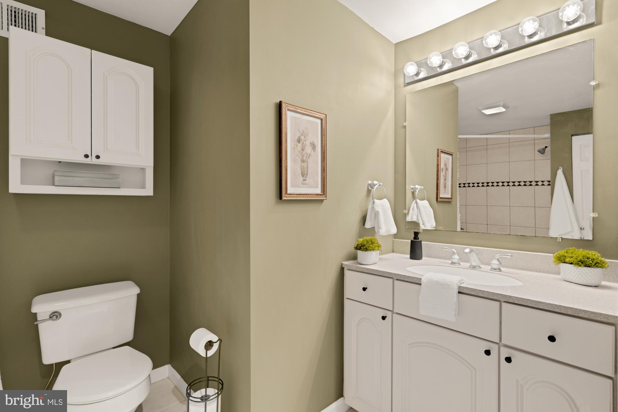 545 Gittings Street Baltimore, MD 21230 - Photo 16 of 40 a bathroom with a granite countertop sink mirror and toilet