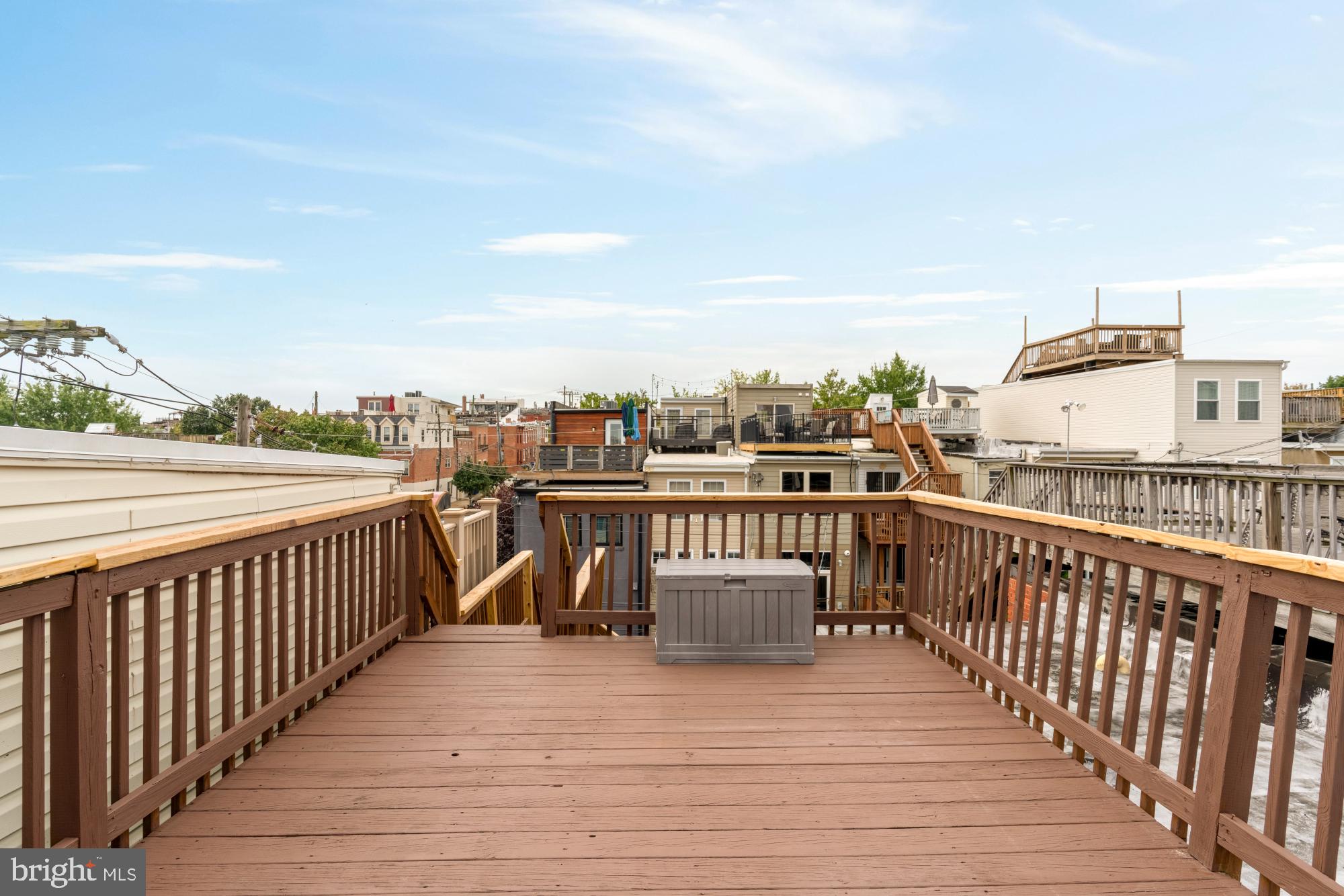 545 Gittings Street Baltimore, MD 21230 - Photo 23 of 40 a balcony with wooden floor and city view