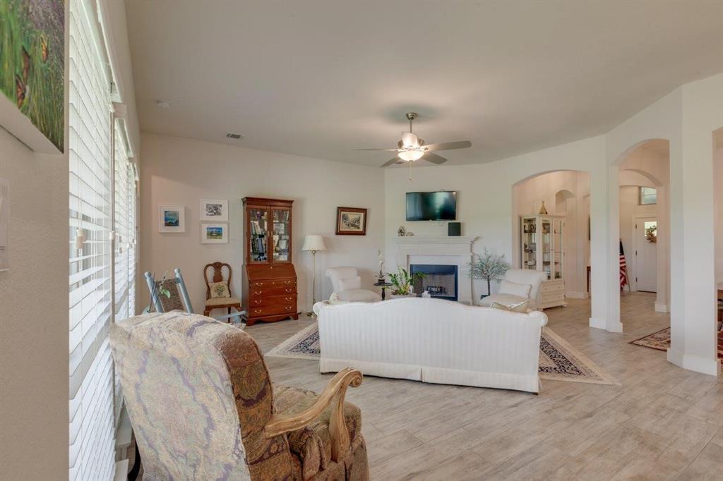 10393 County Road 346 Terrell, TX 75161 - Photo 8 of 29 a living room with furniture and a fireplace