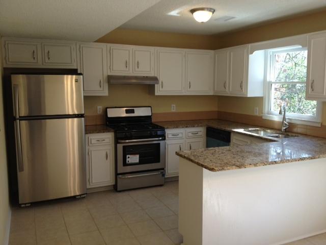 3971 Veracruz Drive, Unit 21 Decatur, GA 30034 - Photo 1 of 1 a kitchen with a refrigerator sink and cabinets