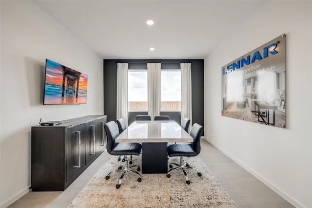 a kitchen with white cabinets and refrigerator
