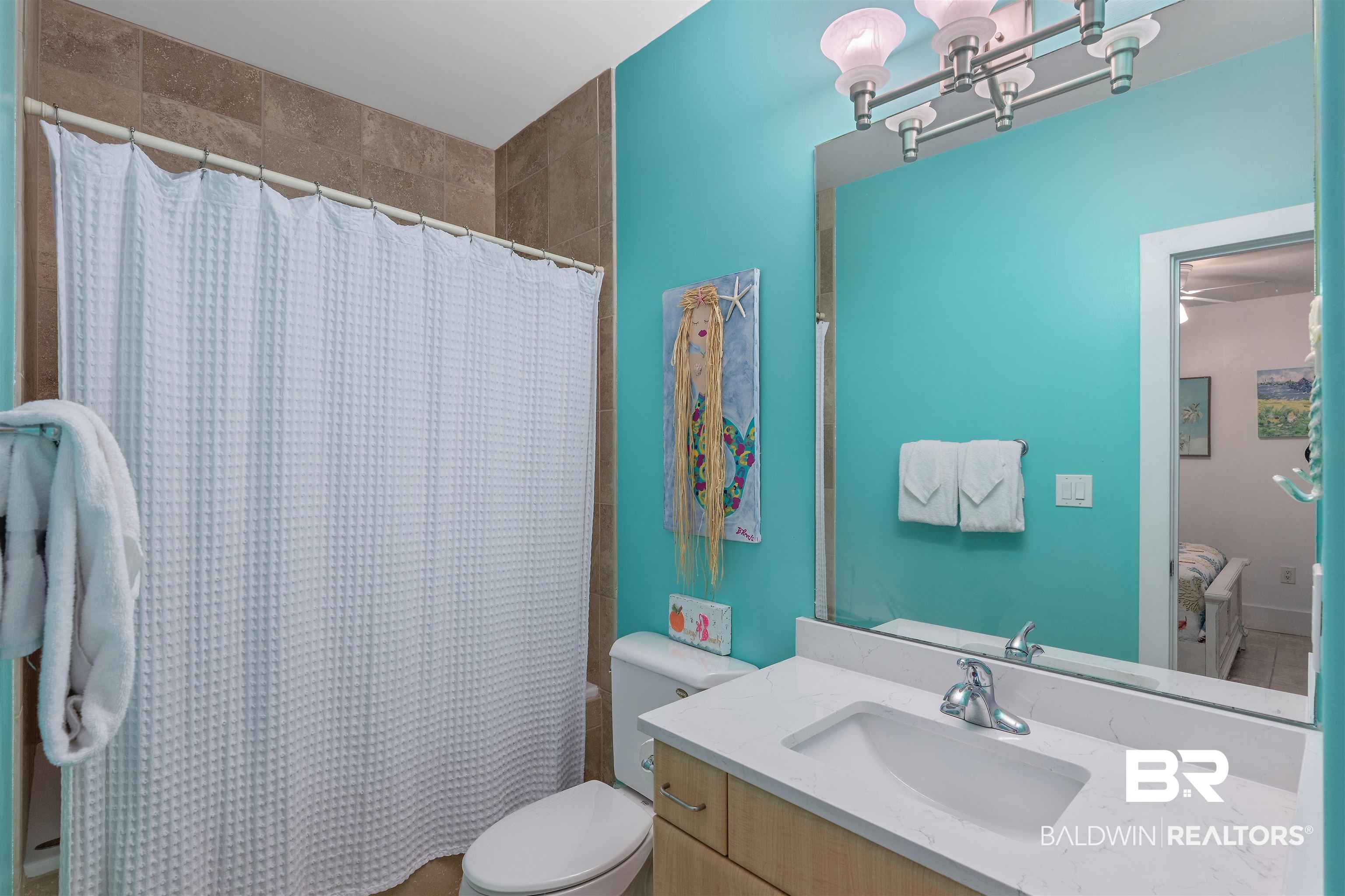 28107 Perdido Beach Boulevard, Unit DPH06 Orange Beach, AL 36561 - Photo 19 of 70 Bathroom with a shower with shower curtain, vanity, and toilet