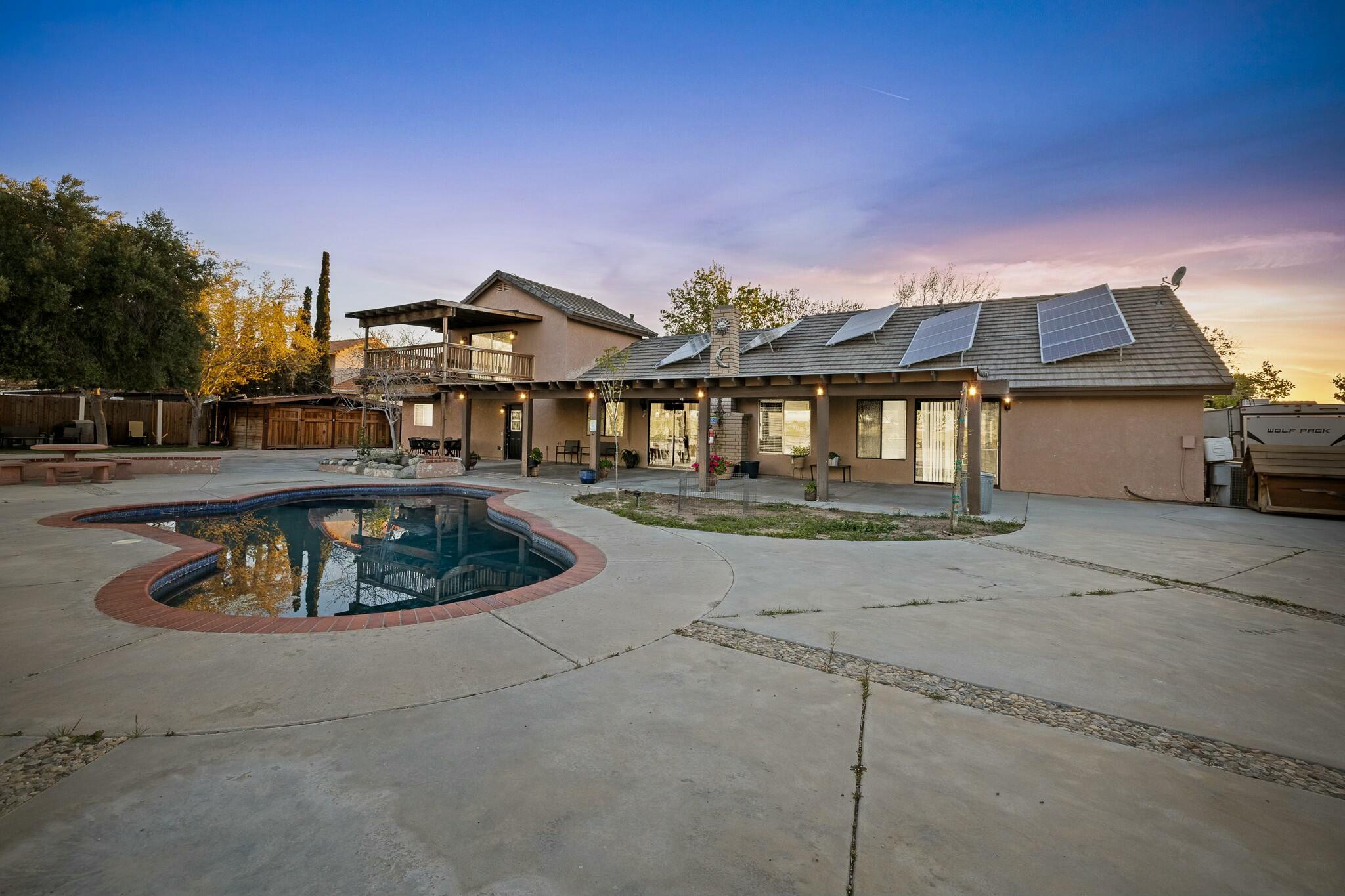 36070 43rd Street East Palmdale, CA 93552 - Photo 1 of 53 a front view of a house with garden