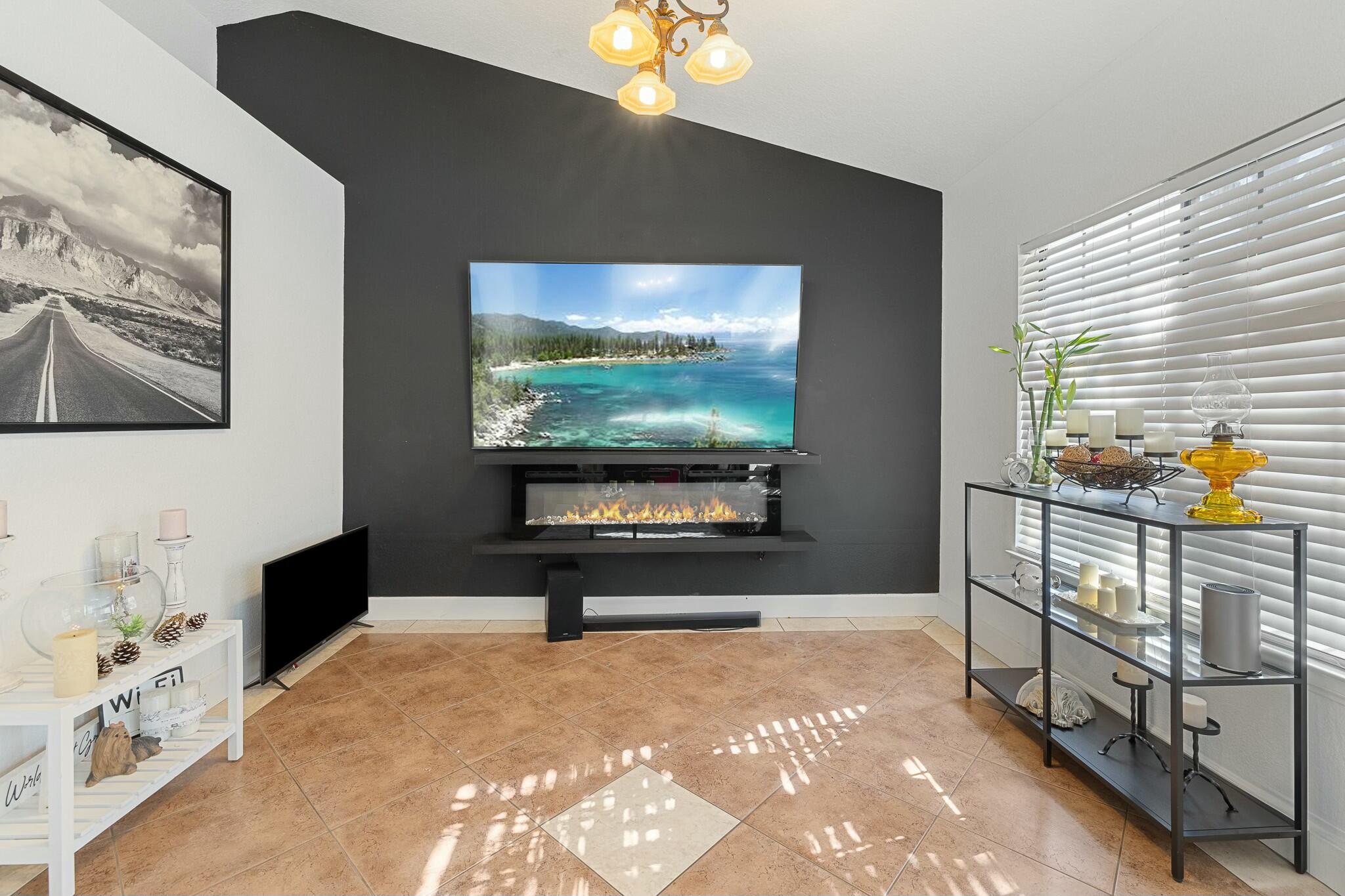 36070 43rd Street East Palmdale, CA 93552 - Photo 13 of 53 a living room with furniture and a flat screen tv