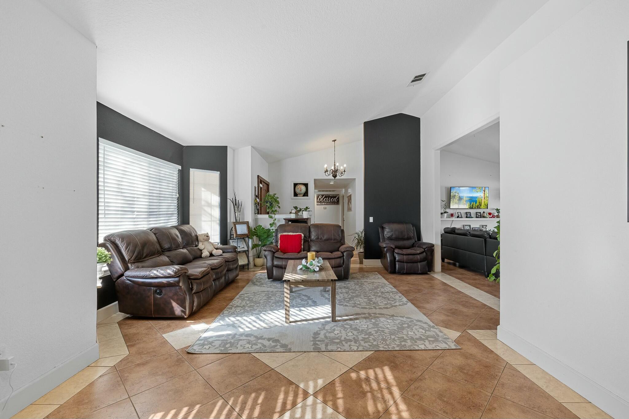 36070 43rd Street East Palmdale, CA 93552 - Photo 14 of 53 a living room with furniture and a mirror