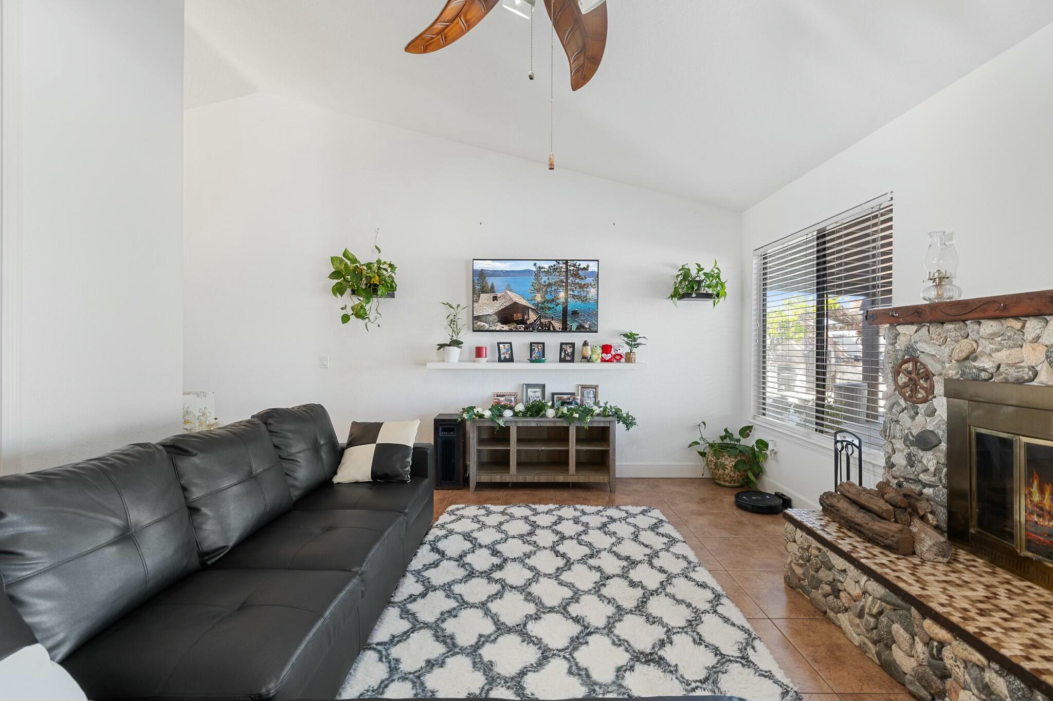 36070 43rd Street East Palmdale, CA 93552 - Photo 17 of 53 a living room with furniture and a fireplace