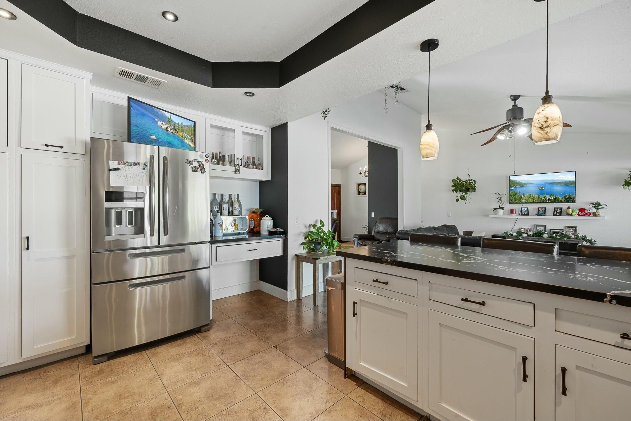 36070 43rd Street East Palmdale, CA 93552 - Photo 26 of 53 a kitchen with a refrigerator a sink and a refrigerator