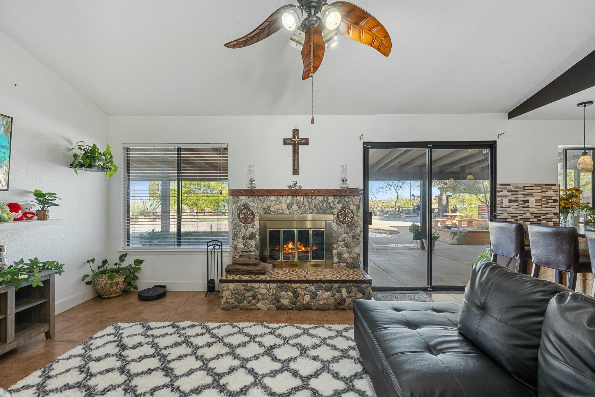 36070 43rd Street East Palmdale, CA 93552 - Photo 27 of 53 a living room with furniture and a fireplace