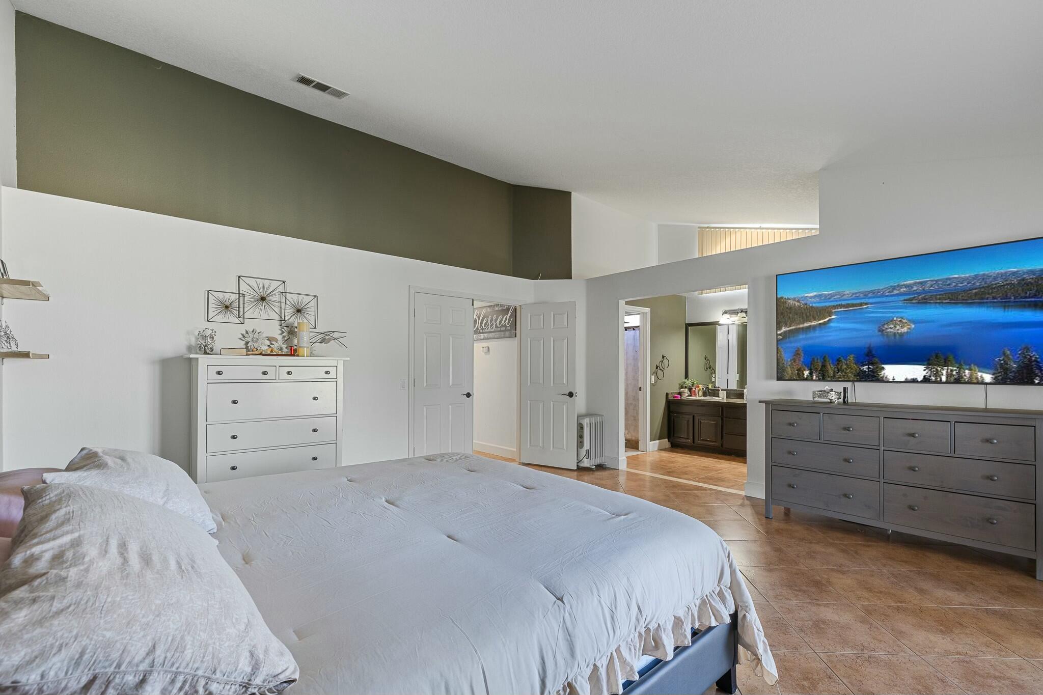 36070 43rd Street East Palmdale, CA 93552 - Photo 30 of 53 a bedroom with a bed and cabinets