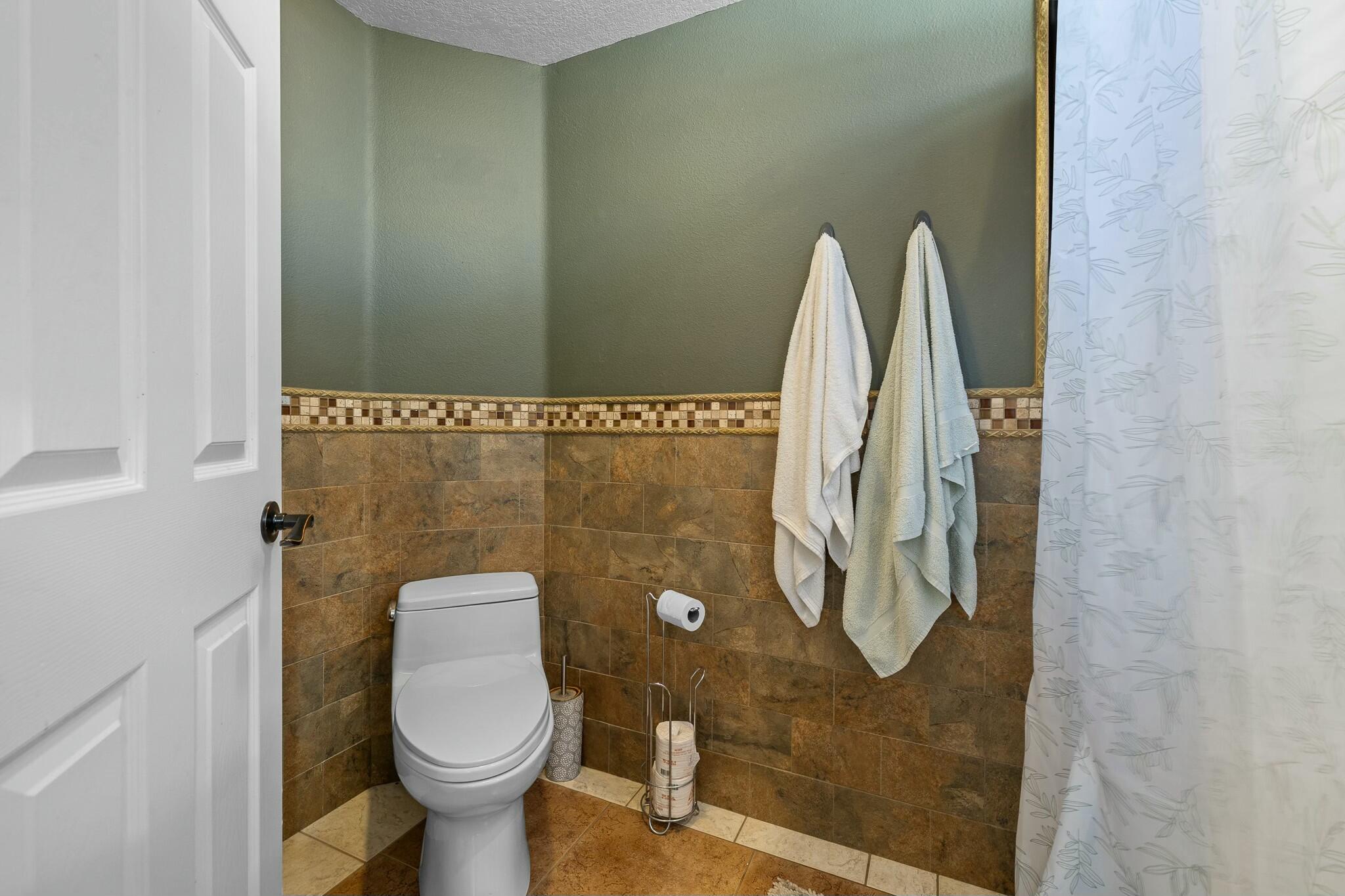 36070 43rd Street East Palmdale, CA 93552 - Photo 33 of 53 a bathroom with a toilet and a shower