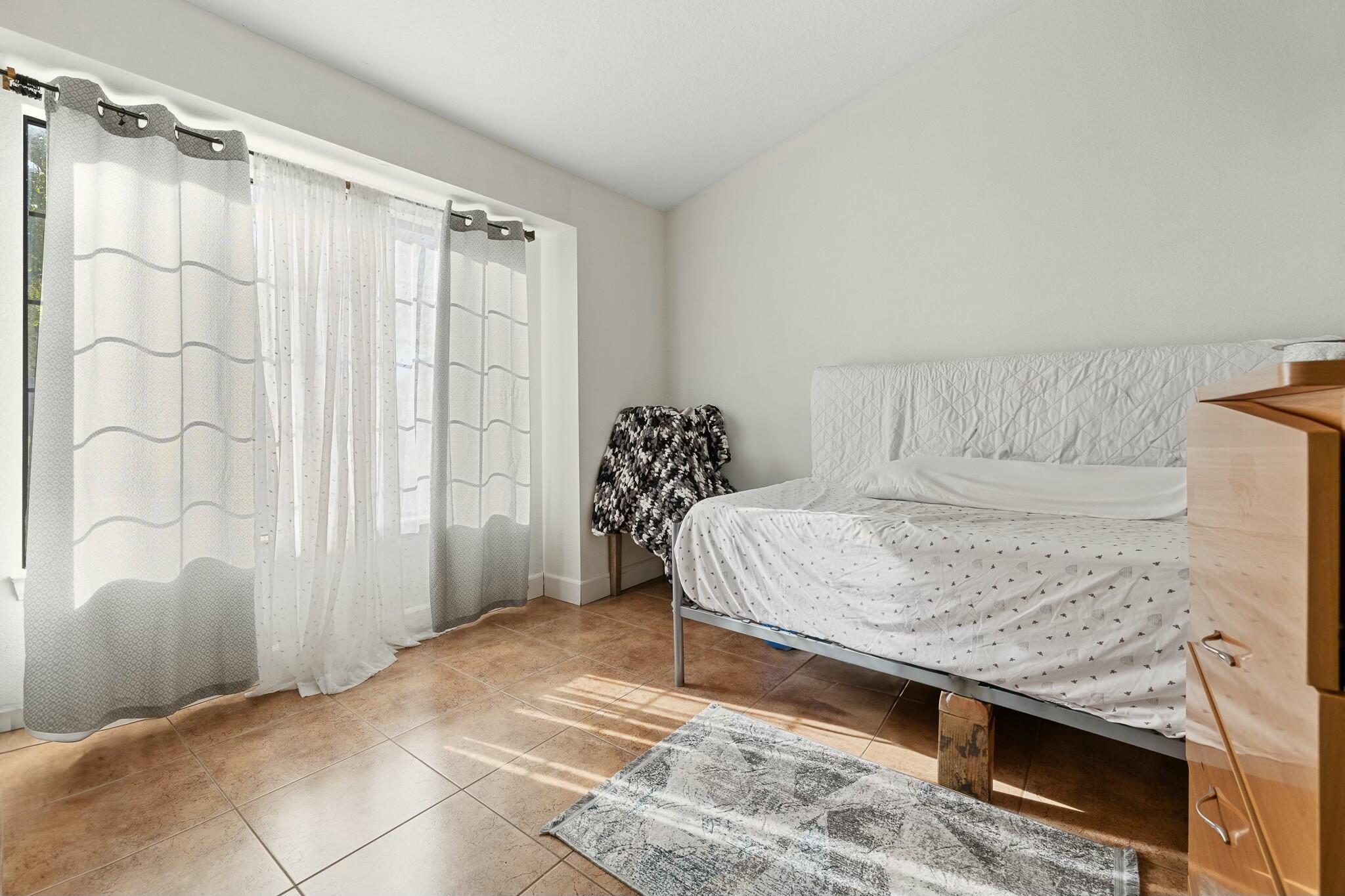 36070 43rd Street East Palmdale, CA 93552 - Photo 38 of 53 a bedroom with a bed and a window