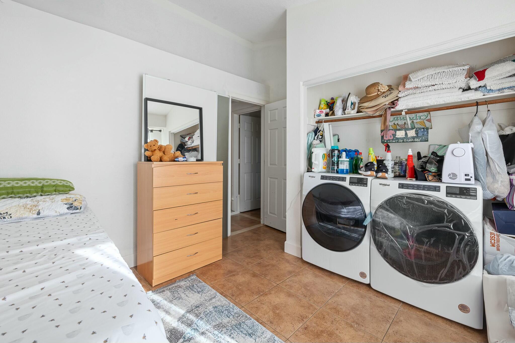 36070 43rd Street East Palmdale, CA 93552 - Photo 39 of 53 a utility room with sink dryer and washer