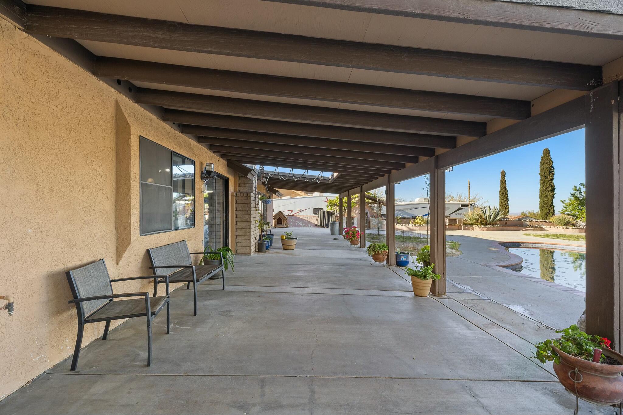 36070 43rd Street East Palmdale, CA 93552 - Photo 40 of 53 a view of porch with seating space