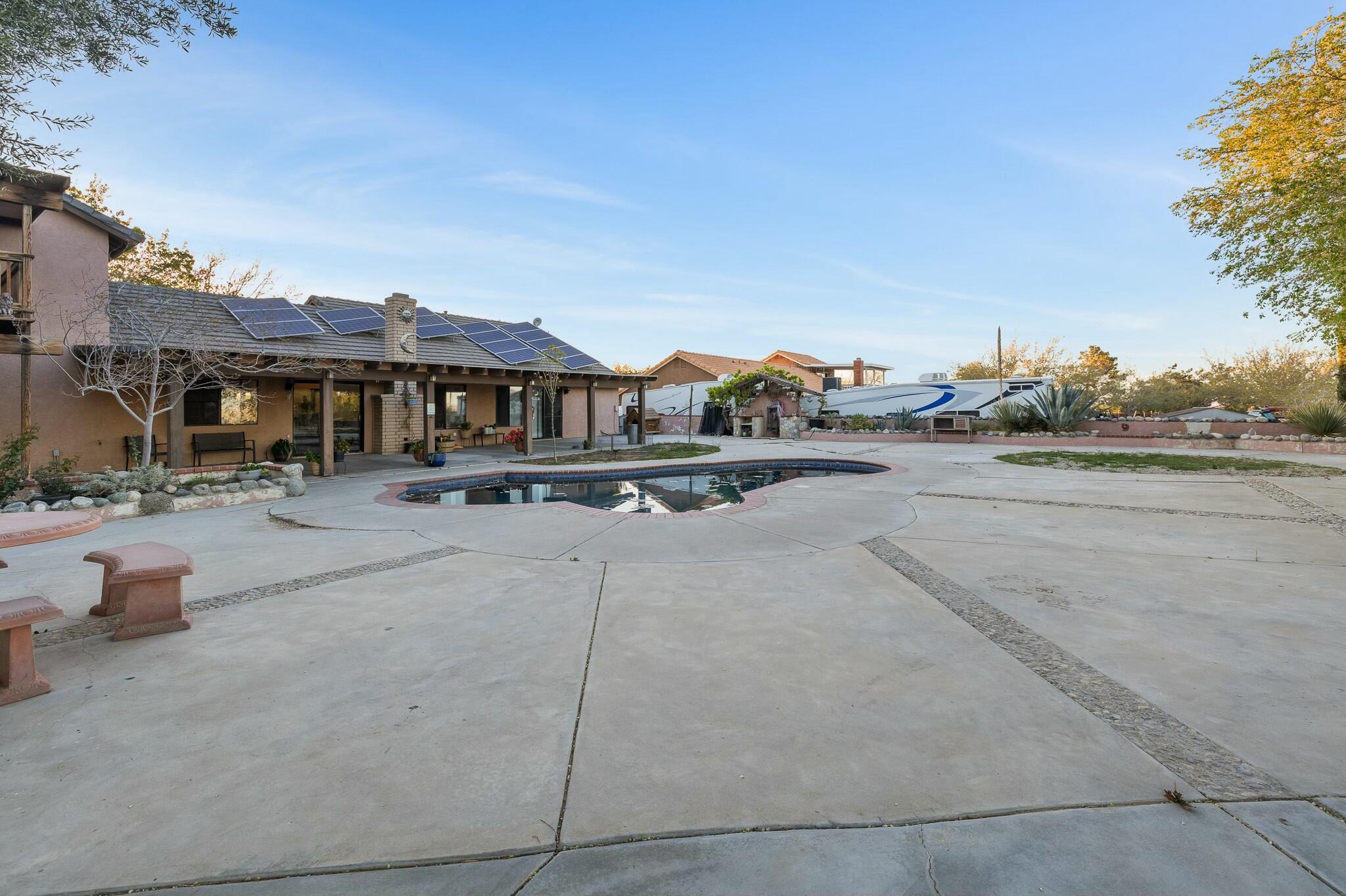 36070 43rd Street East Palmdale, CA 93552 - Photo 47 of 53 a view of swimming pool and outdoor seating