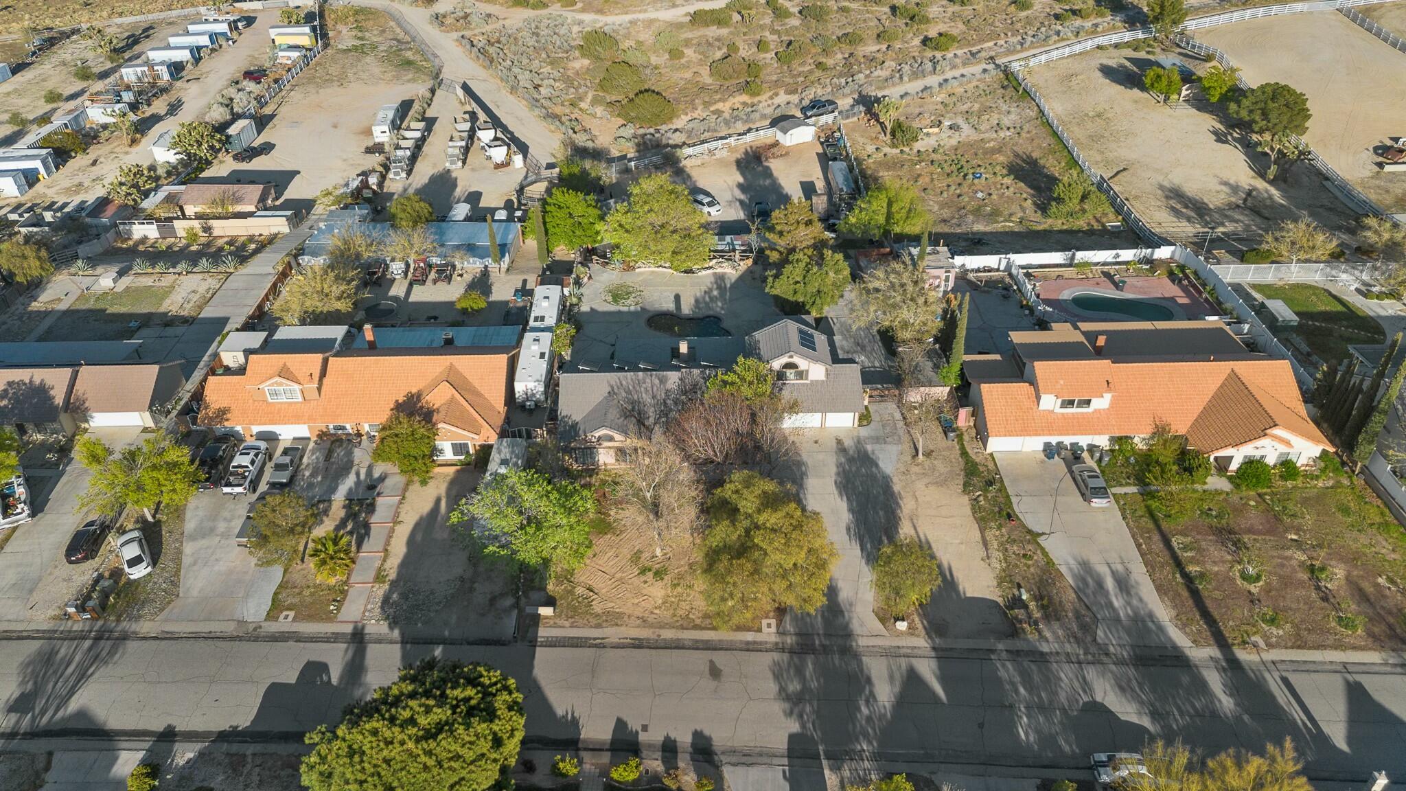 36070 43rd Street East Palmdale, CA 93552 - Photo 49 of 53 an aerial view of residential houses with outdoor space