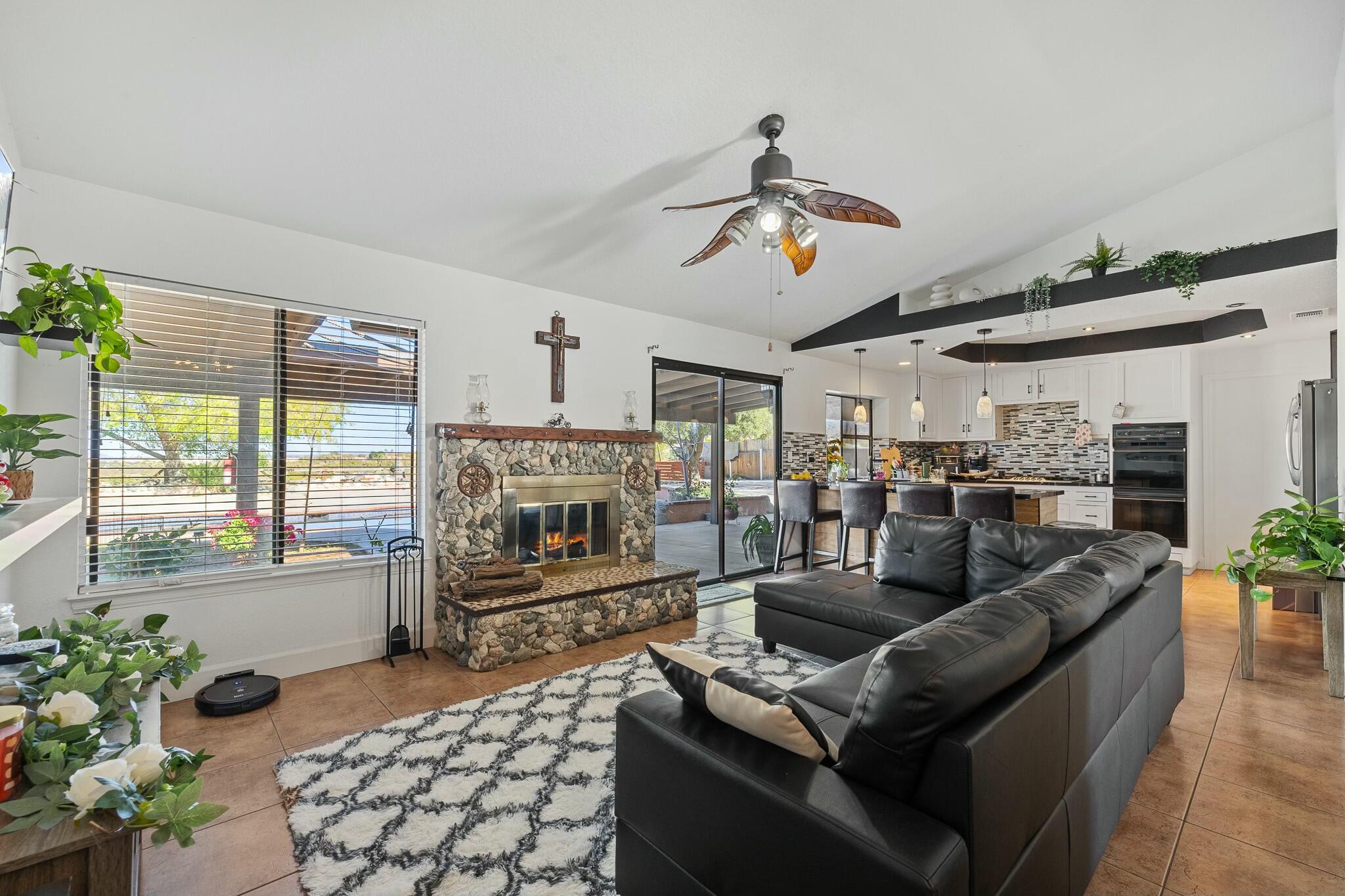 36070 43rd Street East Palmdale, CA 93552 - Photo 10 of 53 a living room with furniture fireplace and flat screen tv