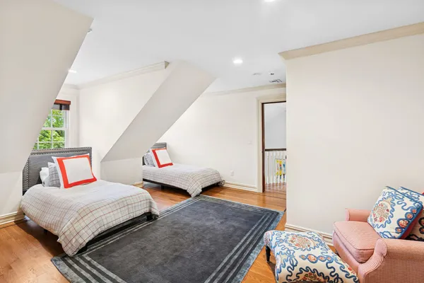 a bedroom with bed and window