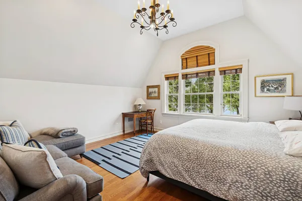 a bedroom with furniture and a window