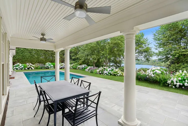 a view of a patio with a table chairs and a table