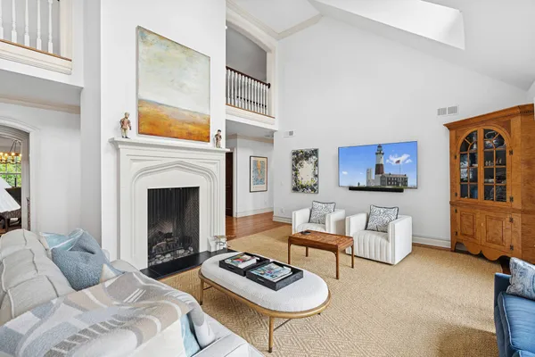a bedroom with furniture and a fireplace