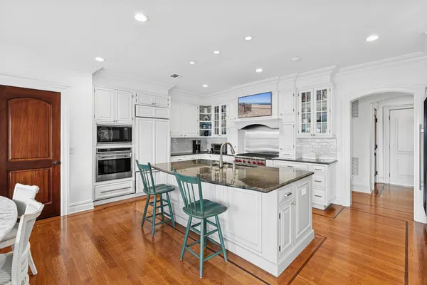 a kitchen with a sink stove and refrigerator