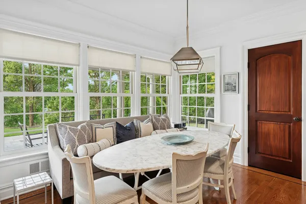 a view of a dining room with furniture window and outside view