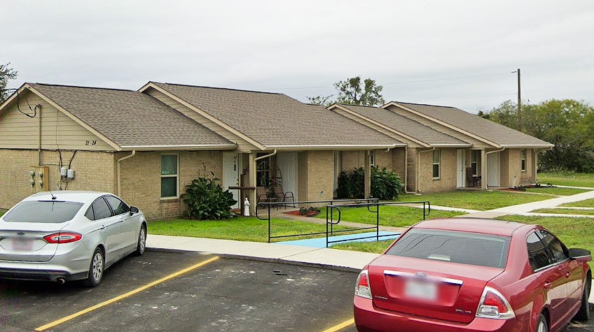 500 West Freeman Street Mathis, TX 78368 - Photo 3 of 9 a front view of a house with a yard table and chairs