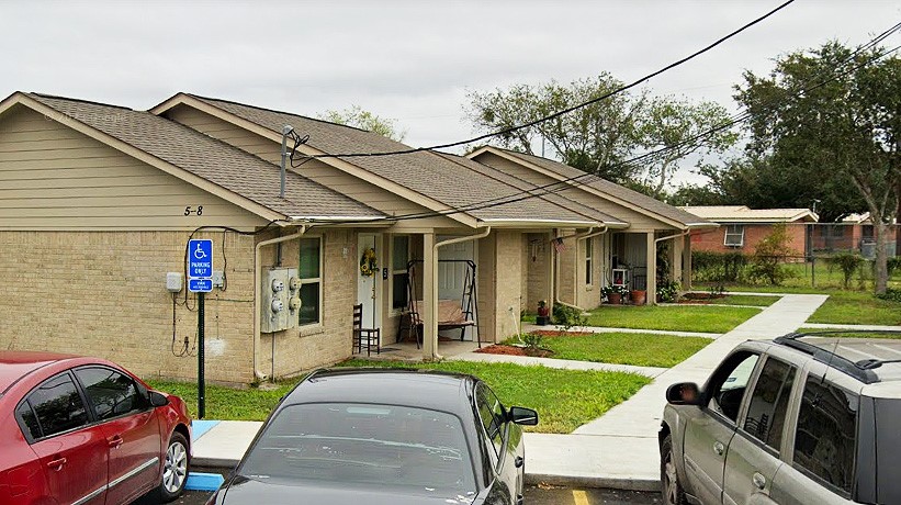 500 West Freeman Street Mathis, TX 78368 - Photo 6 of 9 a front view of a house with garden