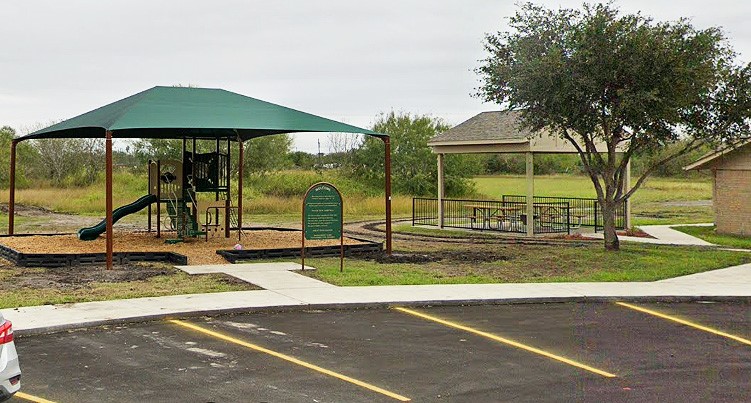 500 West Freeman Street Mathis, TX 78368 - Photo 8 of 9 a view of a park with swings and slides