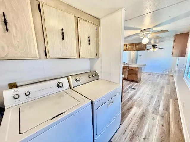 a view of backyard with deck and seating area