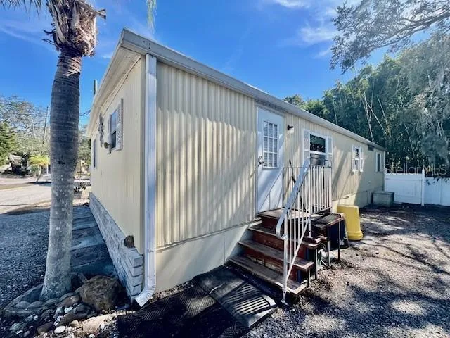 a balcony with table and chairs