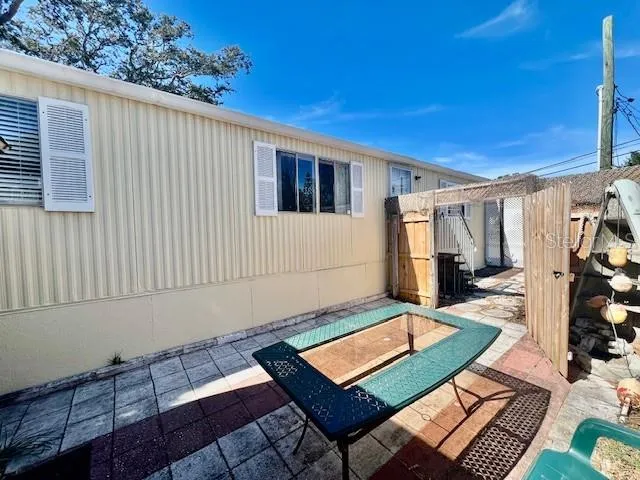 a view of a balcony with chairs