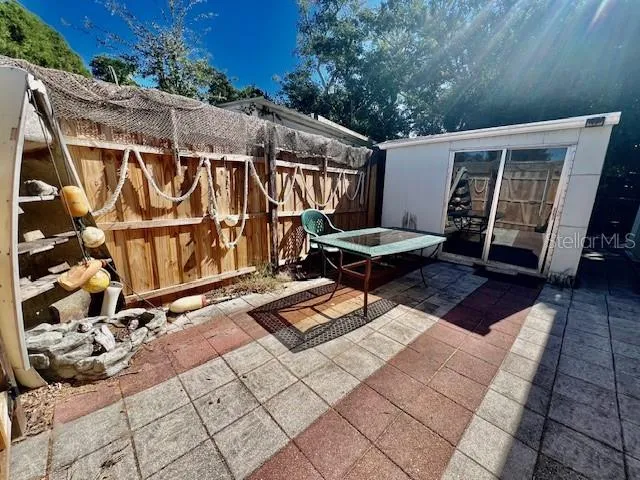 a backyard of a house with outdoor seating