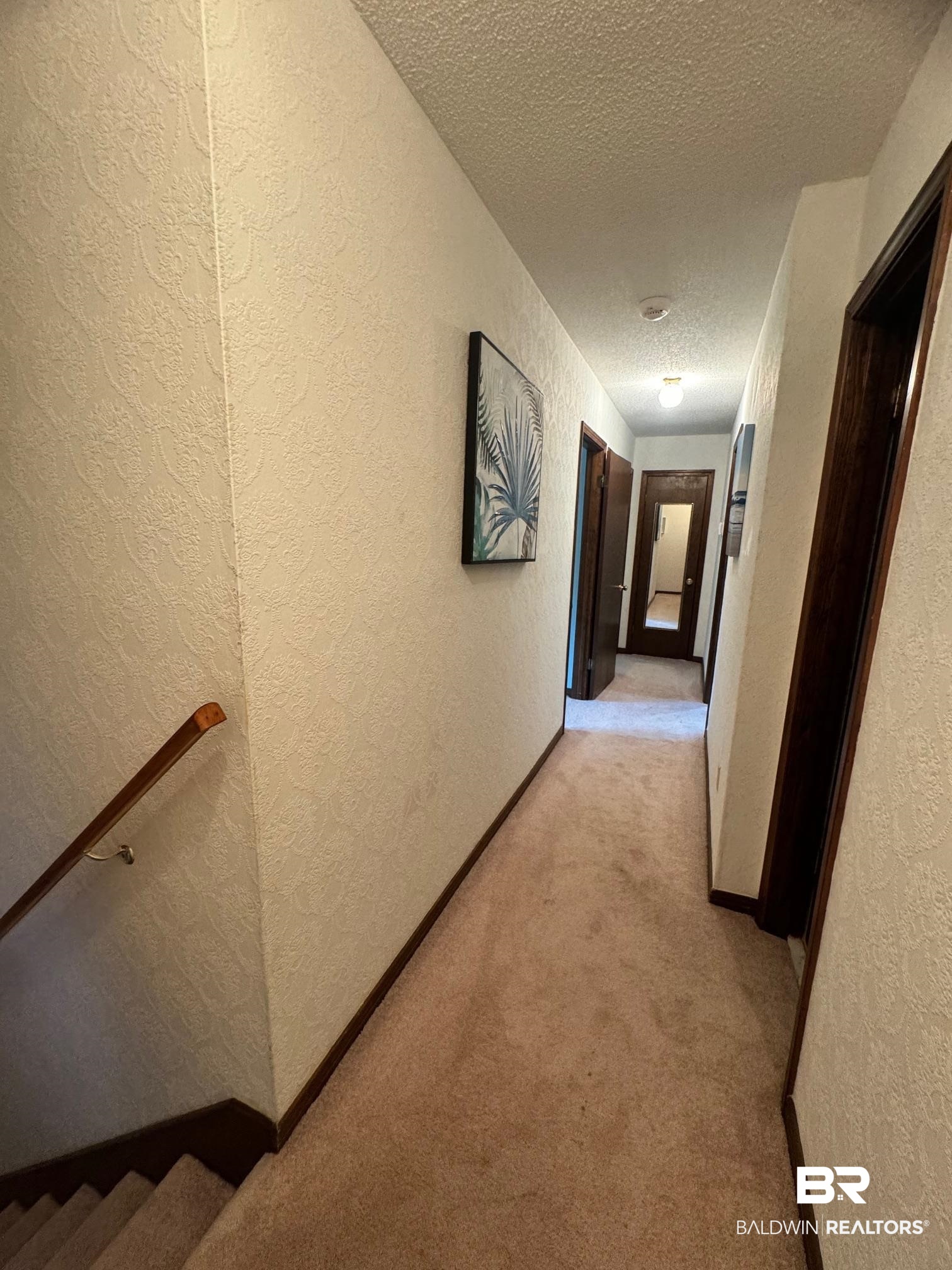 2240 Perdido Circle Lillian, AL 36549 - Photo 16 of 42 Hall with light carpet and a textured ceiling
