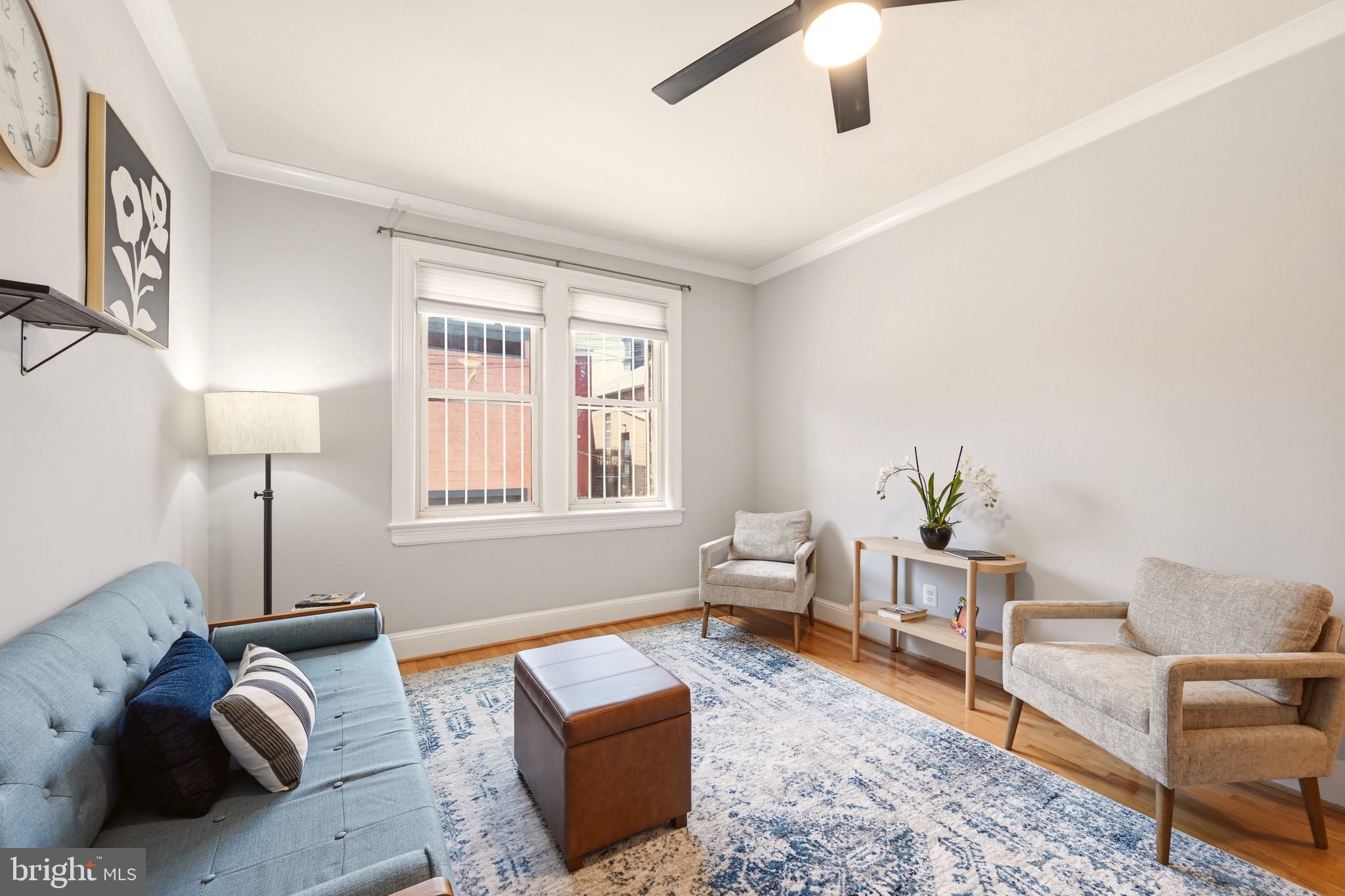 3500 13th Street Northwest, Unit 107 Washington, DC 20010 - Photo 11 of 28 a living room with furniture and a window