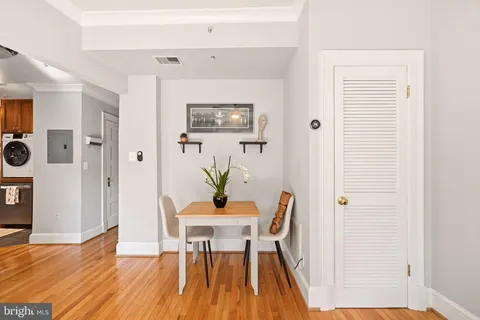 a view of a dining room with furniture and wooden floor