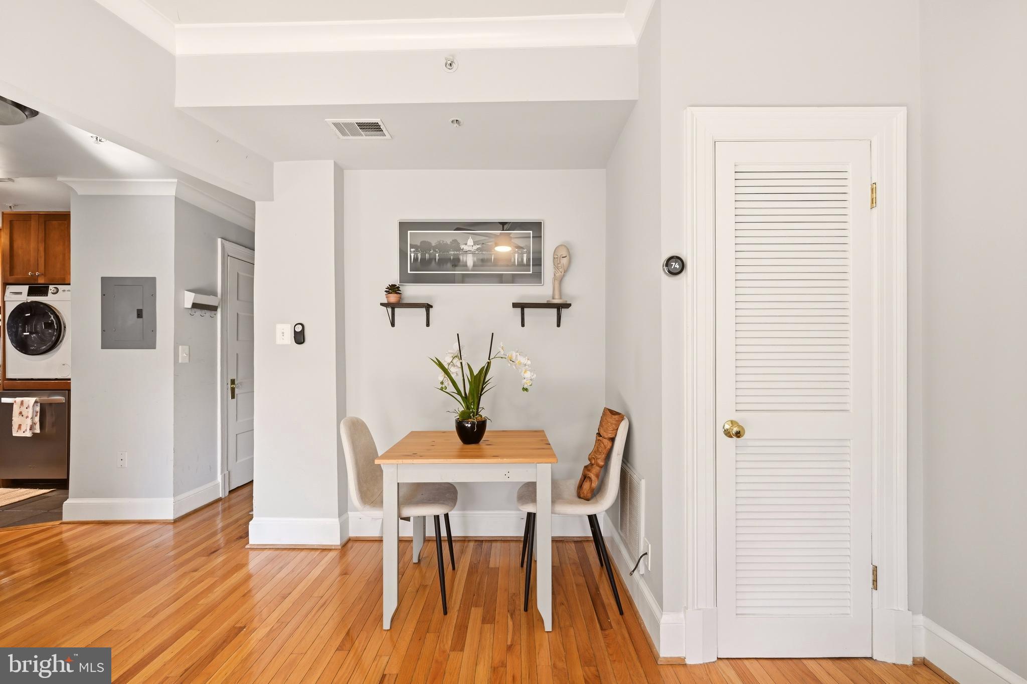 3500 13th Street Northwest, Unit 107 Washington, DC 20010 - Photo 15 of 28 a view of a dining room with furniture and wooden floor