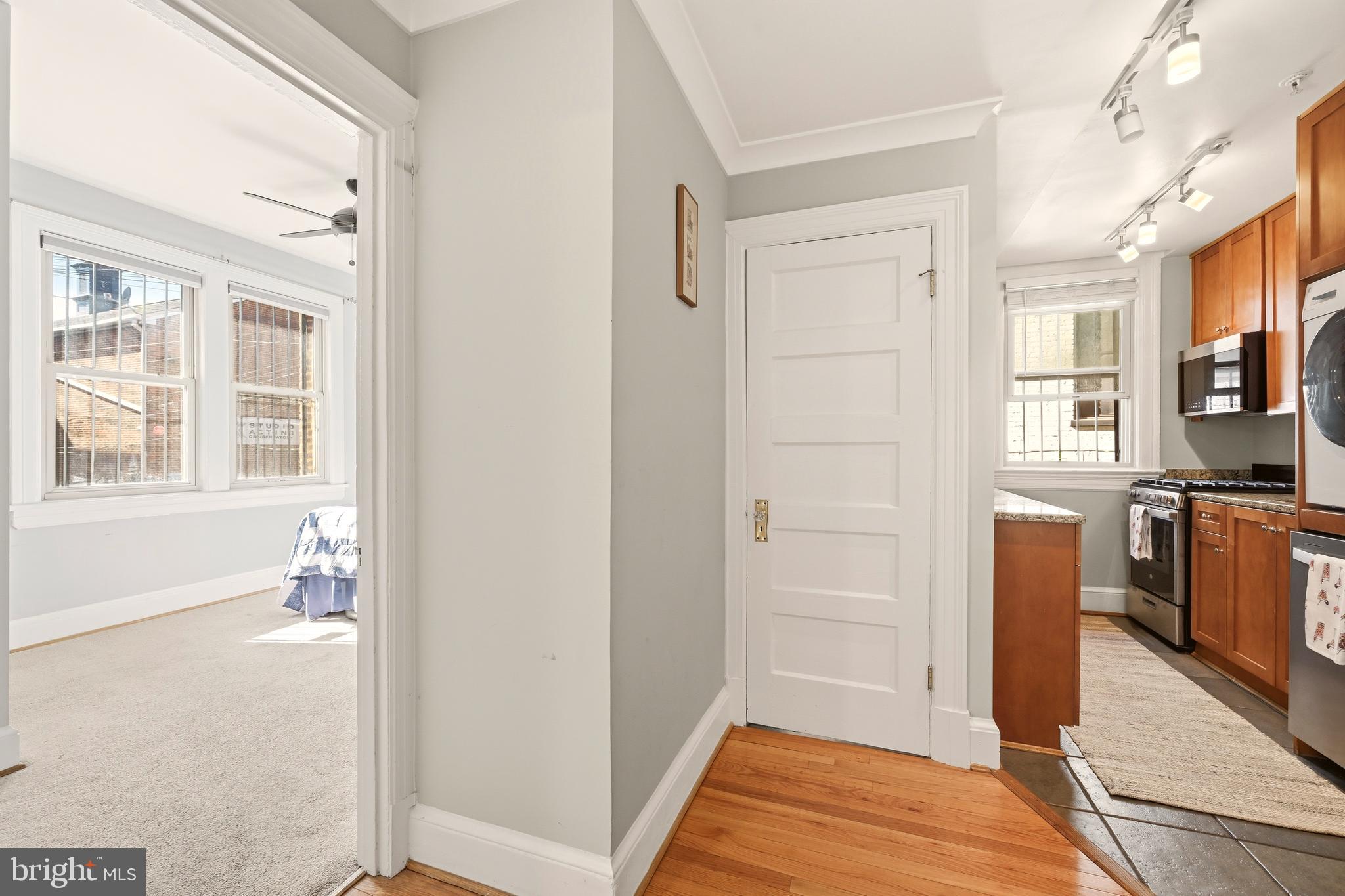 3500 13th Street Northwest, Unit 107 Washington, DC 20010 - Photo 16 of 28 a view of walk in closet with window and bathroom