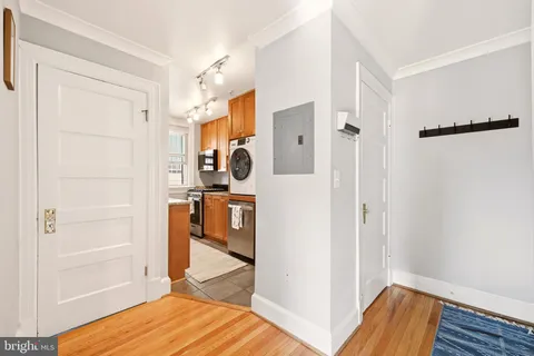a view of walk in closet with empty room