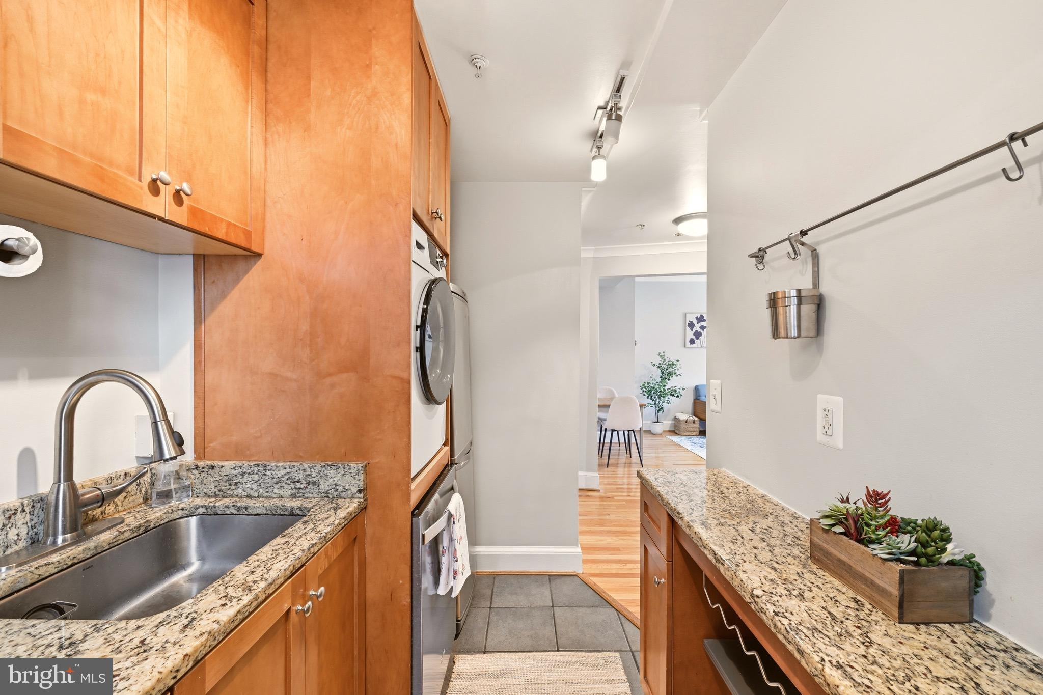 3500 13th Street Northwest, Unit 107 Washington, DC 20010 - Photo 18 of 28 a kitchen with stainless steel appliances granite countertop a sink a stove and a refrigerator