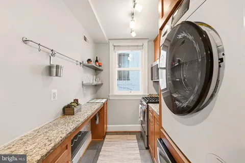 a bathroom with a sink a washer and dryer