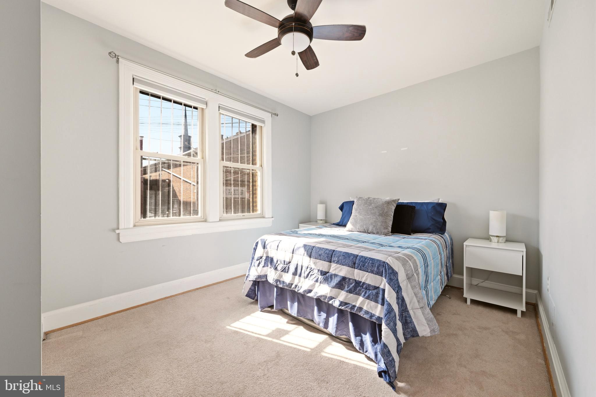3500 13th Street Northwest, Unit 107 Washington, DC 20010 - Photo 24 of 28 a bedroom with a bed and window
