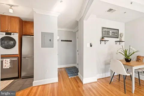 a view of a bedroom with furniture and wooden floor