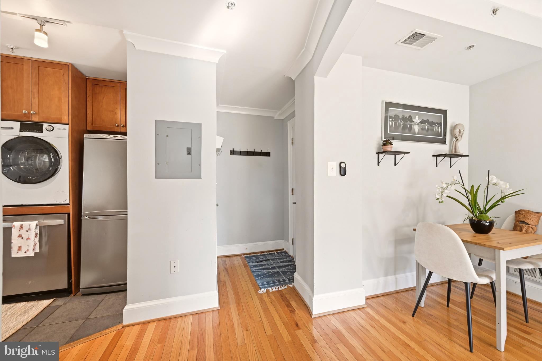 3500 13th Street Northwest, Unit 107 Washington, DC 20010 - Photo 6 of 28 a view of a bedroom with furniture and wooden floor