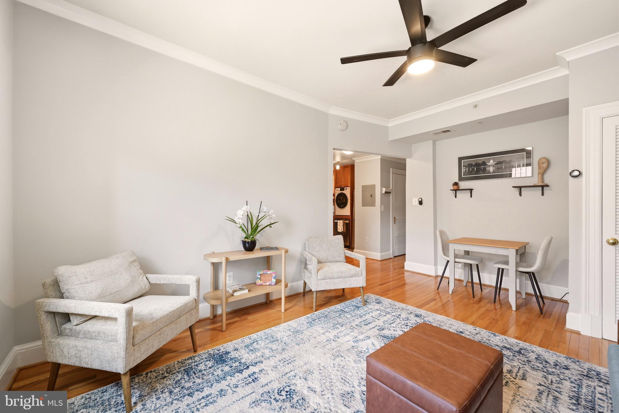 3500 13th Street Northwest, Unit 107 Washington, DC 20010 - Photo 10 of 28 a living room with furniture and a wooden floor