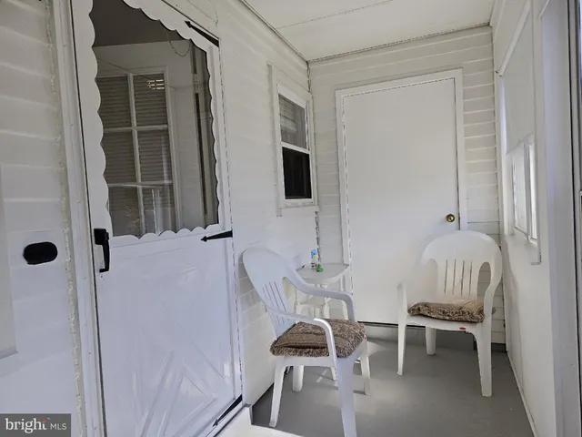a view of a livingroom with wooden floor