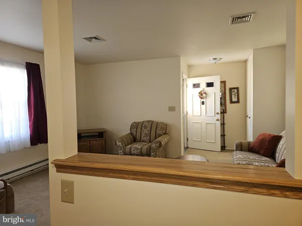 a bedroom with a bed and a mirror