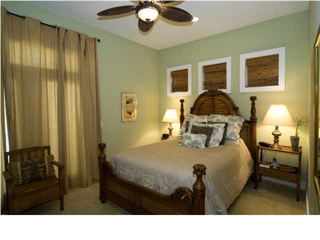 9 Blue Crab Loop Seacrest, FL 32461 - Photo 11 of 28 a bedroom with a bed and wooden floor