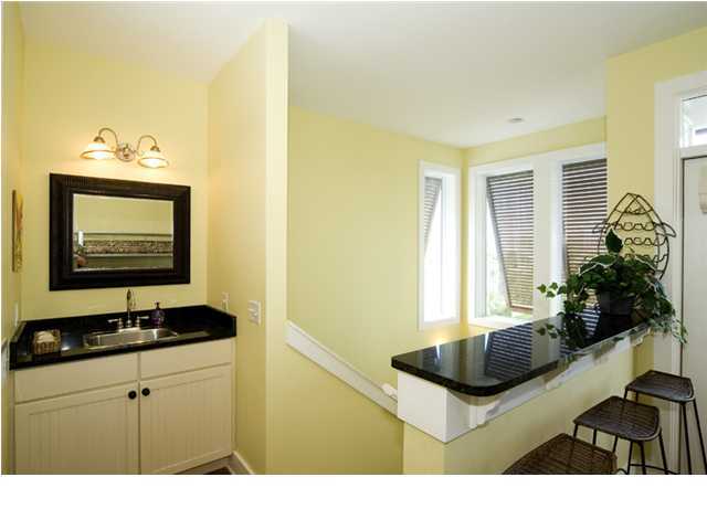 9 Blue Crab Loop Seacrest, FL 32461 - Photo 18 of 28 a bathroom with a sink a mirror and a window